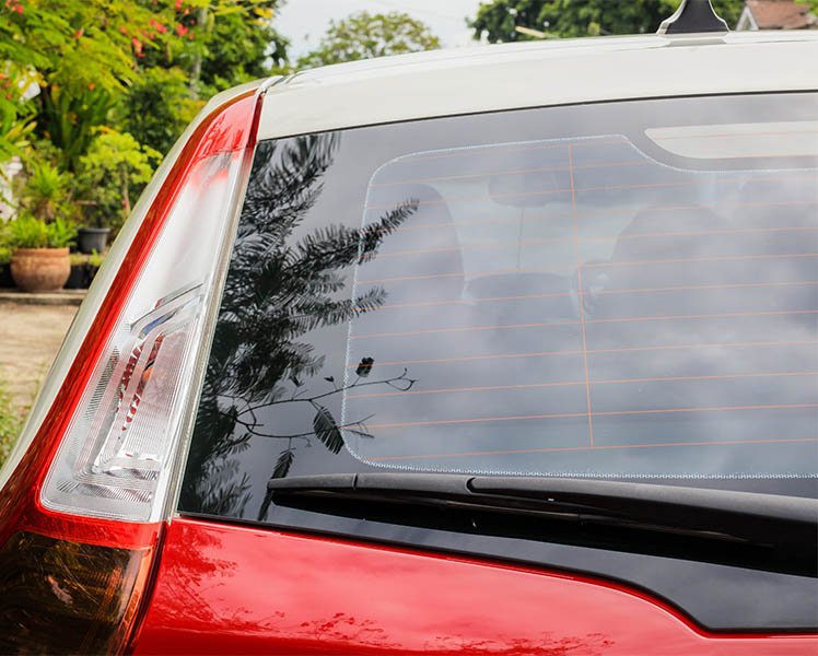 Back view of red car window for sticker