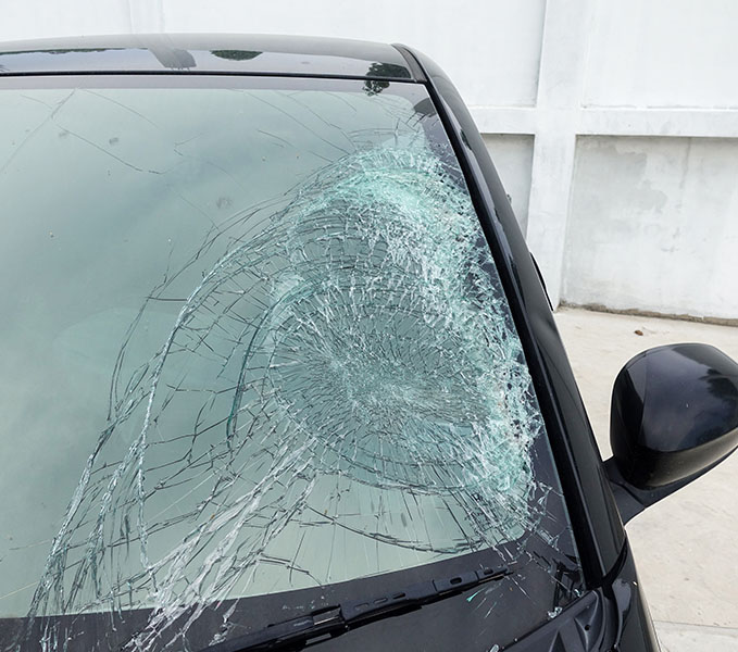 Broken car windshield. Accident of black car