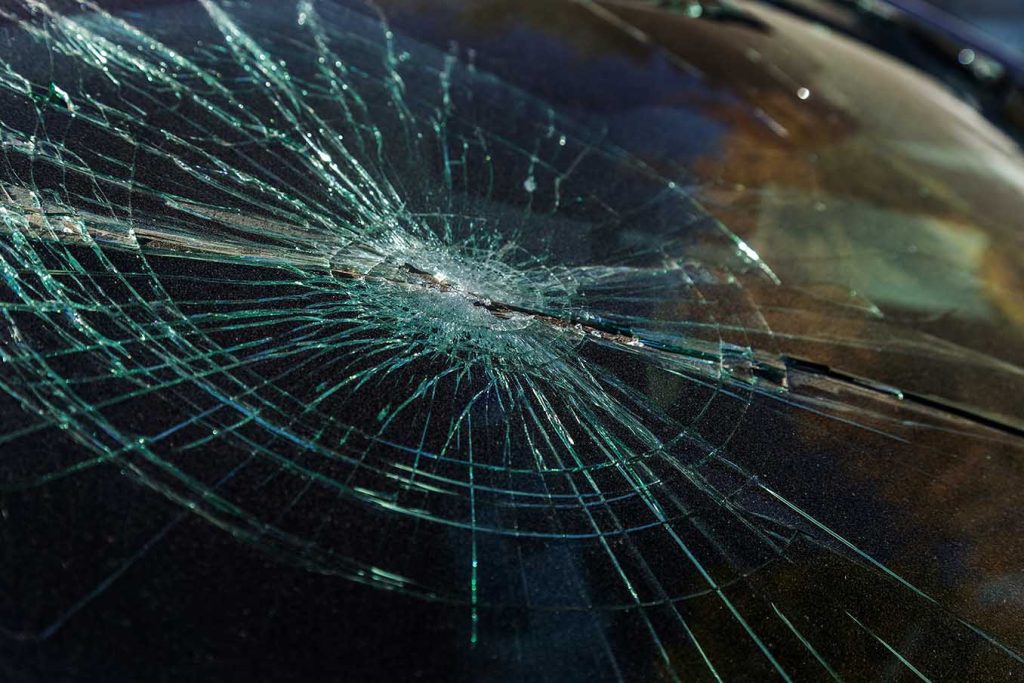 Terrible dangerous car after a fatal accident. Broken windshield. A broken car with broken glass. Сar hazard. Reckless dangerous driving. Broken windshield after fatal accident with a pedestrian